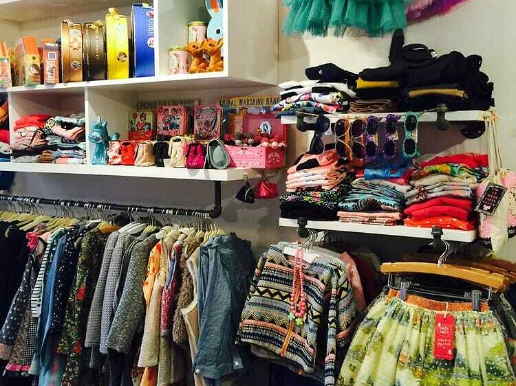 Clothes and shoes displayed in a shop